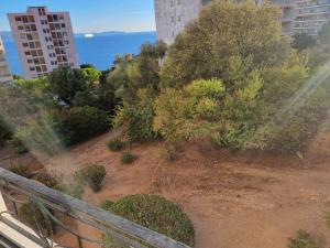 a view of a garden from a balcony at Résidence des îles - Samos III in Ajaccio