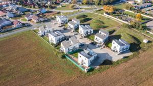 an aerial view of a town with white houses at Vista Pálava - Apartmán Pasohlávky in Pasohlávky