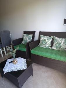 a living room with two couches and a table at Two-bedroom apartment CDE - Area 4 - Close to everything in Ciudad del Este