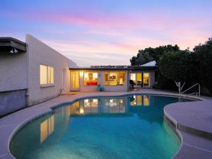 a swimming pool in front of a house at Pebble Retreat-Private Pool-7 Mins Arizona State in Tempe