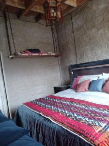 Ένα ή περισσότερα κρεβάτια σε δωμάτιο στο Lodge Malezas del Desierto