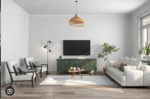 TV a/nebo společenská místnost v ubytování ThreeSixty