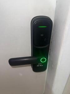 an air freshener is attached to a door handle at Studio apartment - Bom Retiro - S05 in Ipatinga