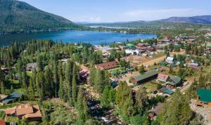 an aerial view of a small town next to a lake at The Loose Moose Book The 11-unit Mountain Lodge! in Grand Lake
