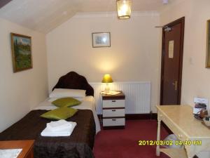 Postel nebo postele na pokoji v ubytování Thorpe Lodge Hotel