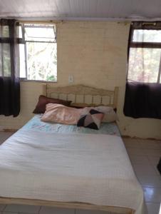 Postel nebo postele na pokoji v ubytování Chácara encanto do luar