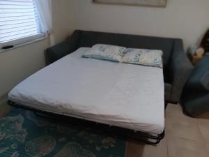 Ένα ή περισσότερα κρεβάτια σε δωμάτιο στο Madeira Bonita