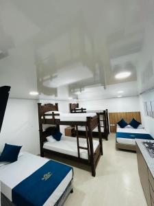 a room with two bunk beds in it at Hotel Las Americas Confort in Estación El Salto