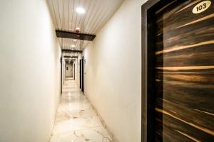 a corridor in a building with a hallway at Hotel O JPS Galaxy Hotel in New Delhi