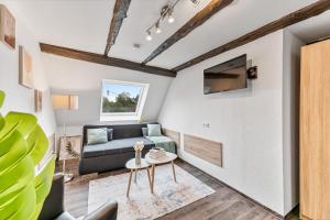 Μια τηλεόραση ή/και κέντρο ψυχαγωγίας στο Charmante Hotelwohnung nahe Pforzheim, ruhige Lage