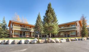 a large building with trees in front of it at Park Meadows 6A by Ski Country Resorts in Breckenridge