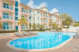 a swimming pool in front of a building at Ria Hotel in San Felipe de Puerto Plata +17 photos