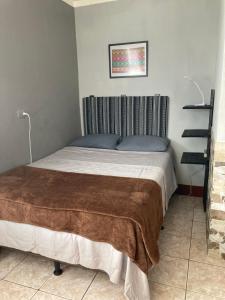 a bedroom with a bed in a room at Lake view room with terrace in San Pedro La Laguna