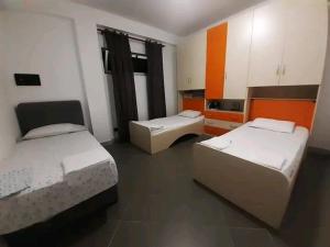 a room with two beds in a room at Villas Mari-Anna for rent best view in Durrës