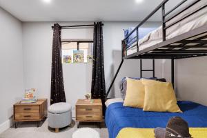 a bedroom with a bed and a bunk bed at 3bd 2ba hot tub, game room, bunk beds in Long Pond +54 photos