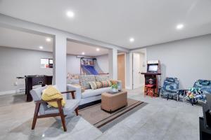 a living room with a couch and a table at 3bd 2ba hot tub, game room, bunk beds in Long Pond