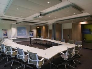 a large conference room with a large table and chairs at Novotel Roissy Saint Witz in Saint-Witz +102 photos