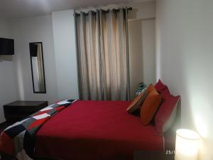 Giường trong phòng chung tại Departamento Cala Cala