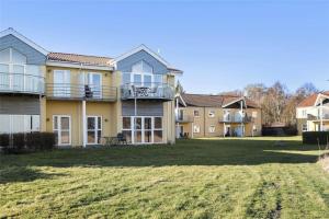 a large house with a lawn in front of it at HA259-Hals-Portlandsvej-97-B-1-mf in Hals