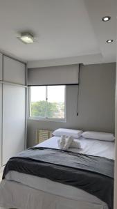 En eller flere senge i et værelse på Apartamento COP 30 + 8 billeder