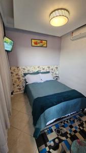 Ένα ή περισσότερα κρεβάτια σε δωμάτιο στο Suite Grande Rio - Ar condicionado