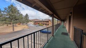 a balcony with a view of a house at Himont Motel in Fall River Mills