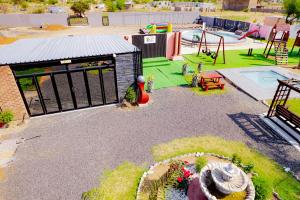 a play area with a playground with a playground at Precious Guest House in Manamakgoteng