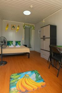 a bedroom with a bed with bananas on the floor at Banana Bar in San Juan