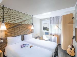 Ένα ή περισσότερα κρεβάτια σε δωμάτιο στο Hotel ibis Porto Gaia +132 φωτογραφίες