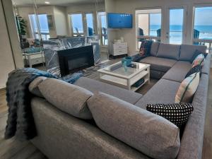a living room with a couch and a fireplace at Modern Coastal Escape Breathtaking Ocean in Imperial Beach