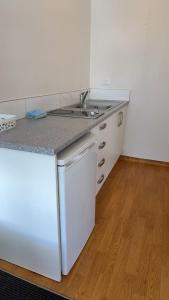 Η κουζίνα ή μικρή κουζίνα στο Achilles Motel