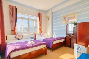 Postel nebo postele na pokoji v ubytování Thanh Tran Guesthouse Lý Sơn
