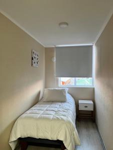 Ένα ή περισσότερα κρεβάτια σε δωμάτιο στο Departamento villarrica