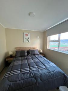 Ένα ή περισσότερα κρεβάτια σε δωμάτιο στο Departamento villarrica