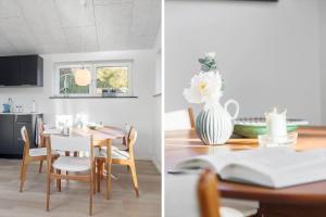 a dining room and kitchen with a table and a vase of flowers at LF10362-Hurup-Thy-Fjordstraede-25 in Doverodde