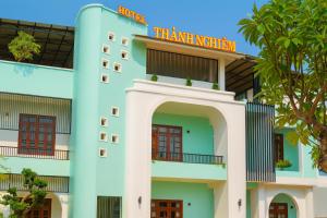 a building with a sign for the hawaiian institution at Thành Nghiêm Hotel Ninh Hòa in Ninh Hòa
