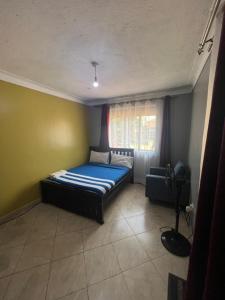 Postel nebo postele na pokoji v ubytování Vine suites + 2 fotografie