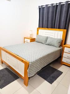 a bedroom with a bed with a black curtain at Luxury Beachside Escape 3BR 2BA with Pool & Ocean Views in San Felipe de Puerto Plata