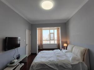 Gambar di galeri bagi Central Street River View Apartment di Harbin