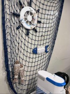 a fishing net with two figurines on it at Cozy Room with Private bathroom & Entrance in Carson