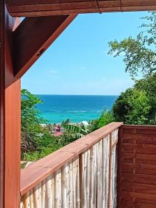 a balcony with a view of the ocean at Studio in Capesterre-de-Marie-Galante