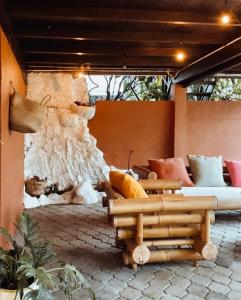 a living room with a couch and a fireplace at Lakeside retreat and Golf in Bedugul in Bedugul