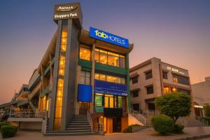a hospital building with a sign on top of it at FabHotel Prime IP Indrapuram in Ghaziabad