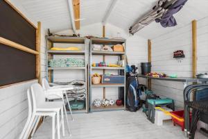 a room with a table and chairs and a shelf at FY290-Faaborg-Egholmvej-14 in Faaborg