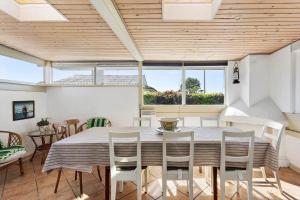 a dining room with a table and chairs at FY268-Faaborg-Horsehoved-23 in Fåborg +25 photos
