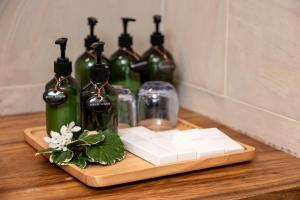 a group of wine bottles sitting on a table at Samaraya Wellness Resort in Amphoe Koh Samui