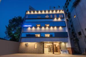 a building with lights on top of it at Via Shri Krishna in Vadodara