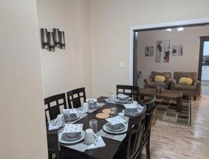 a dining room with a table and chairs at 347 Des Meurons Street Unit A and Unit B in Bélanger +3 photos