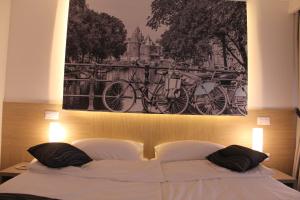 Letto o letti in una camera di Hotel Grad