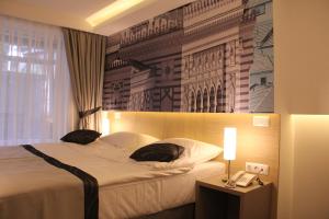 Letto o letti in una camera di Hotel Grad